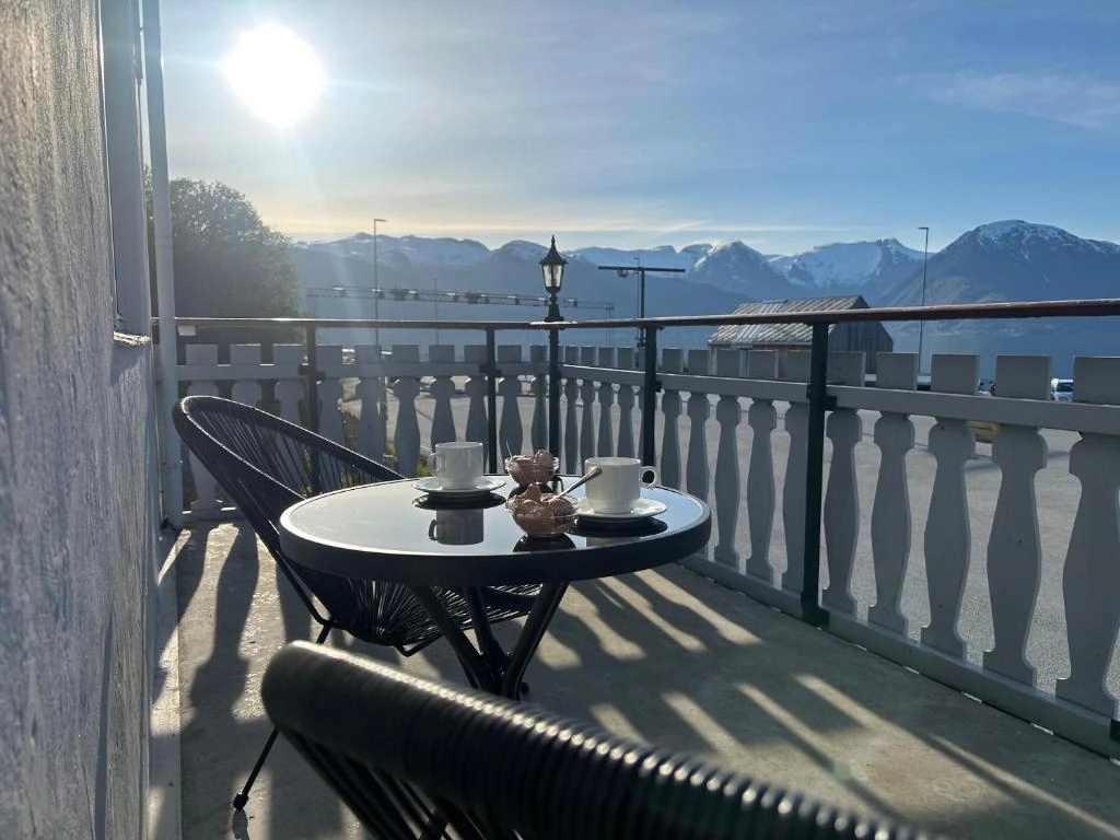 Terrace with fjord and mountain views at Sognefjord Gjesteheim